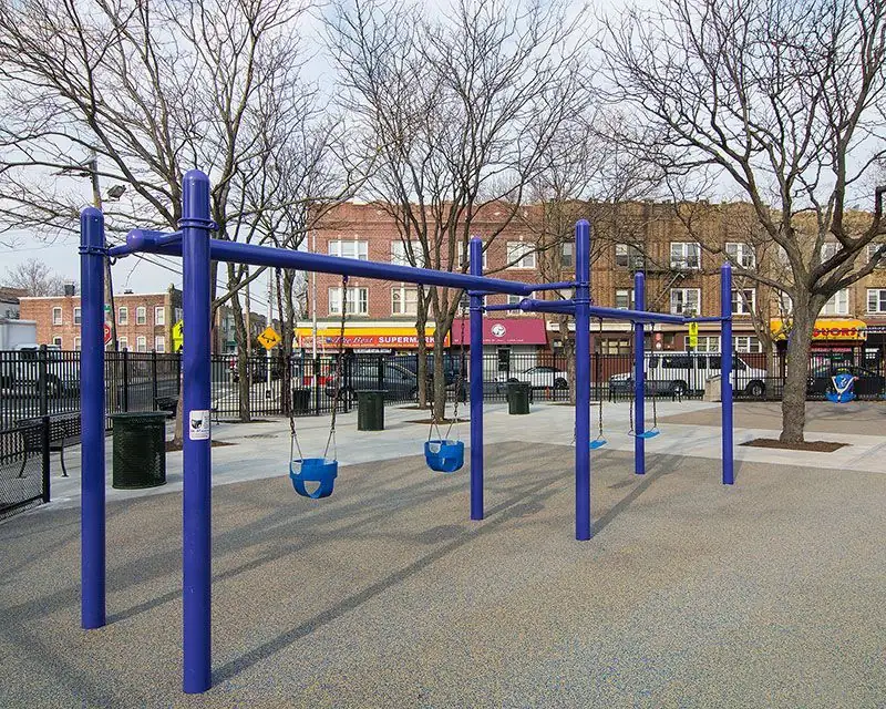 Municipal park plaza with new poured surfacing, sidewalk and curb line laid by Adamo Brothers