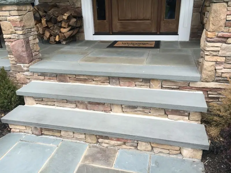 Bluestone entry steps with stacked stone risers built by Adamo Brothers Construction